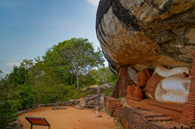 Buddha statue under rock outcropping on Pidurangala.