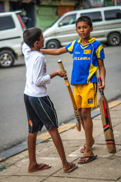 Local kids playing cricket on our street.